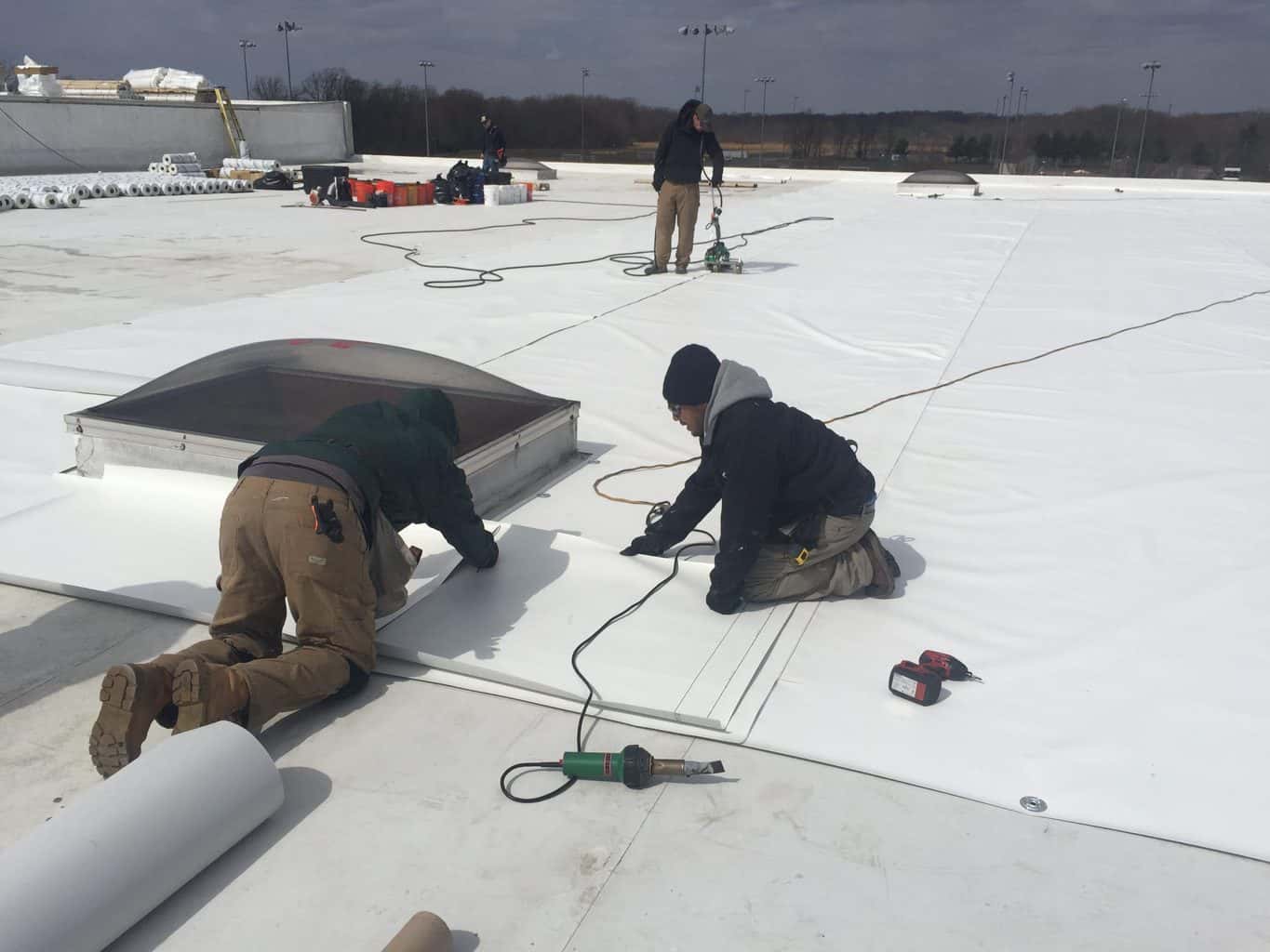 Commercial Flat Roofing Contractors | at work | getflatroofing.com  