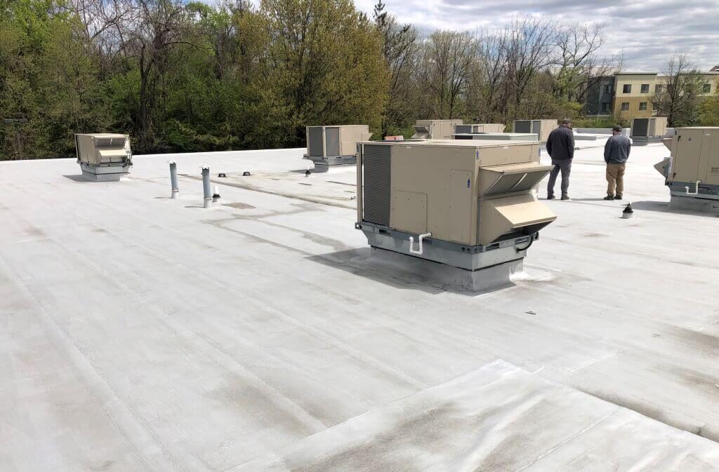 Commercial Flat Roof Inspectors on Roof | getflatroofing.com