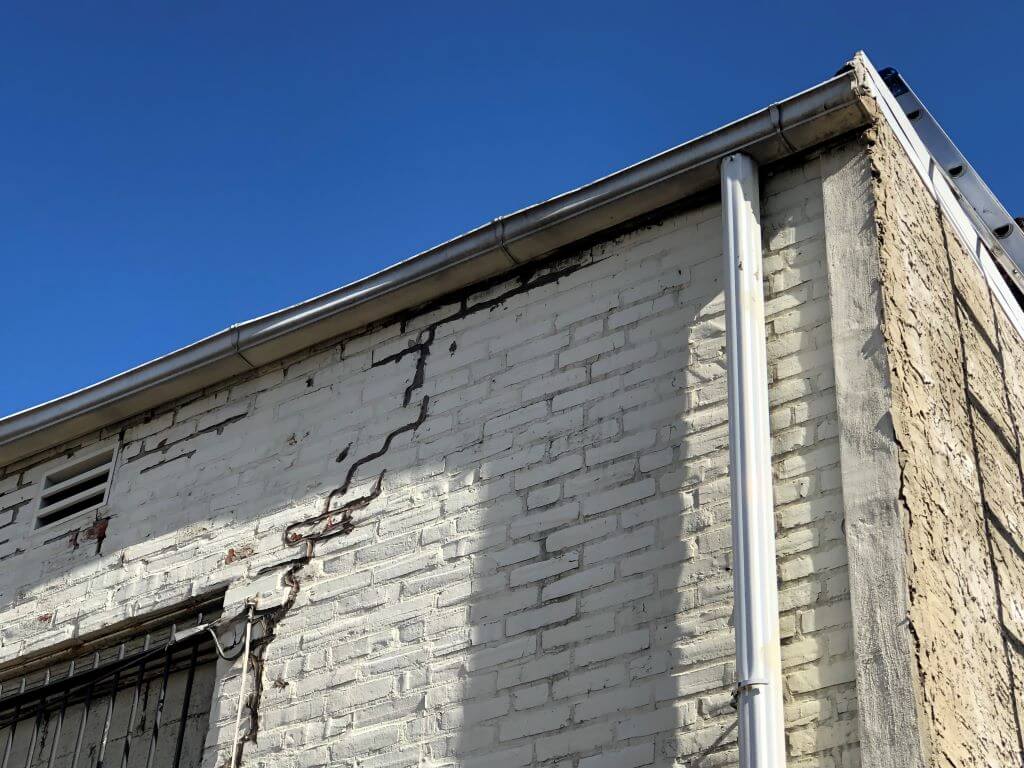 Cracked Walls Due to Maintenance Neglect | getflatroofing.com 