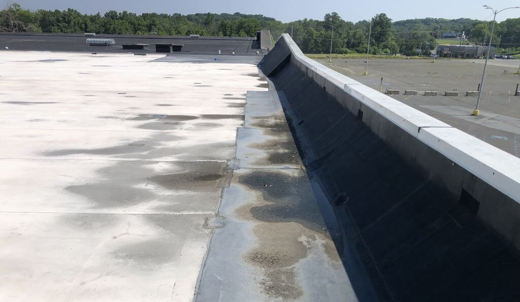 A Dirty White Flat Roof | getflatroofing.com 