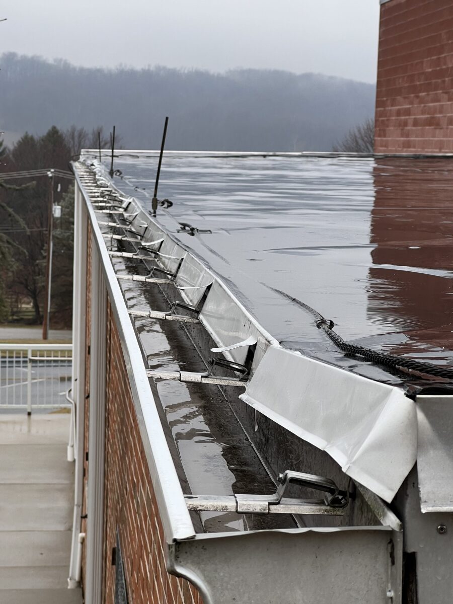 Damaged Residential Gutters on Commercial Flat Roof System | www.getflatroofing.com