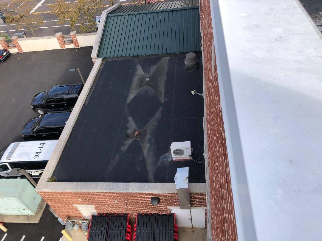 Example Commercial Flat Roof Cricket | getflatroofing.com