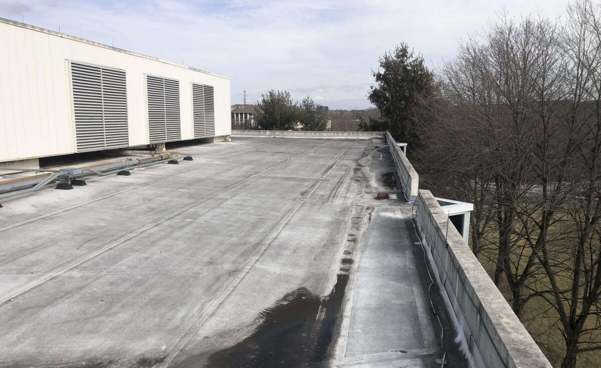 Commercial Flat Roof in Need of Resurfacing | getflatroofing.com
