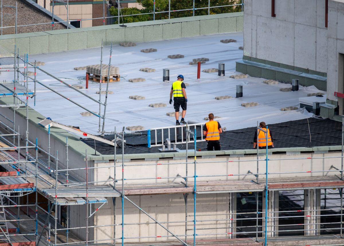 Workers On a Commercial Flat Roof | getflatroofing.com